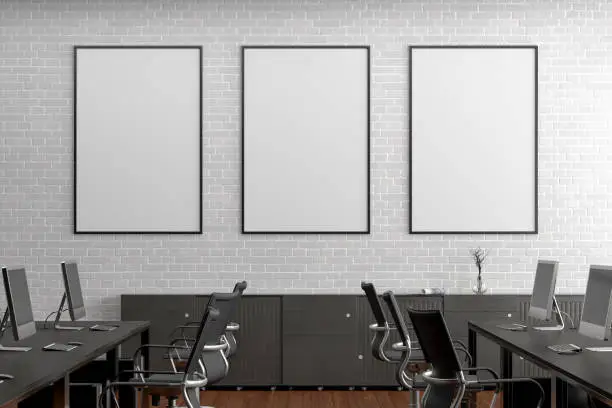 Three blank vertical posters mock up on the white brick wall in office interior. 3d render.