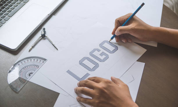 istock Graphic designer creative design sketch drawing logo Trademark brand Workspace 1196968926