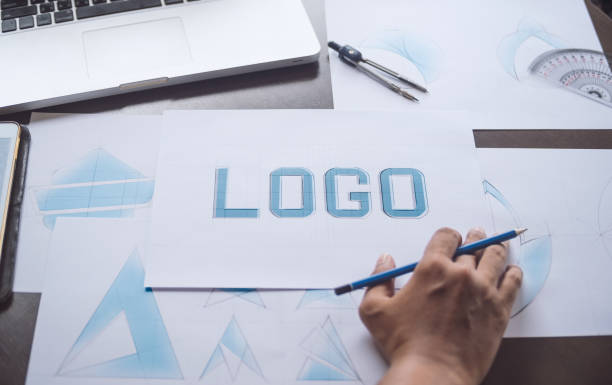 istock Graphic designer creative design sketch drawing logo Trademark brand Workspace 1196968927