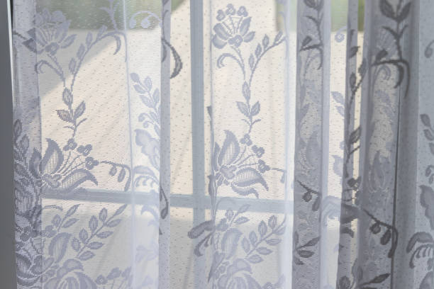 istock white transparent curtain. white lace curtain. 1196969571