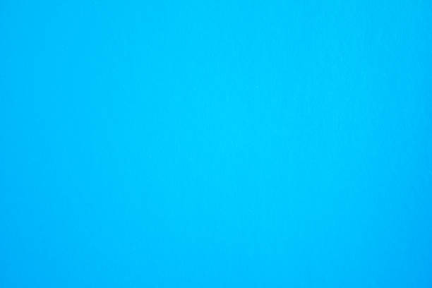 Blue sheet of cardboard paper texture background.