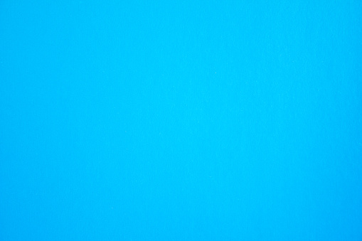 Blue sheet of cardboard paper texture background.