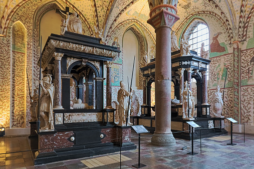 Roskilde, Denmark - December 14, 2015: Interior of Chapel of the Magi (or Christian I's Chapel) in Roskilde Cathedral with sepulchral monuments of the Danish kings Christian III (left) and Frederick II (right). The Gothic chapel was built in the 15th century. The Christian III's monument was created by the Flemish sculptor and architect Cornelis Floris de Vriendt in 1574-1575 and placed in the chapel in 1580. The Frederick II's monument was built 1594–1598 by the Flemish sculptor Gert van Egen, a pupil of Cornelis Floris.