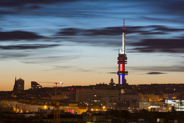 Zizkov television tower illuminated with the colors of Czech flag at sunrise, Prague, Czech Republic Zizkov television tower illuminated with the colors of Czech flag at sunrise, Prague, Czech Republic former czechoslovakia stock pictures, royalty-free photos & images
