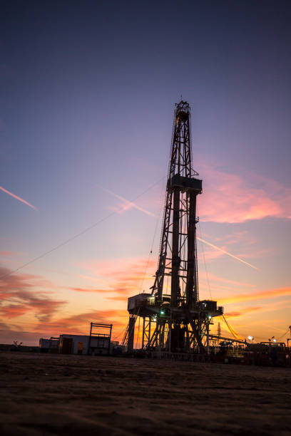 istock Oil drilling platform at sunset 1196977156