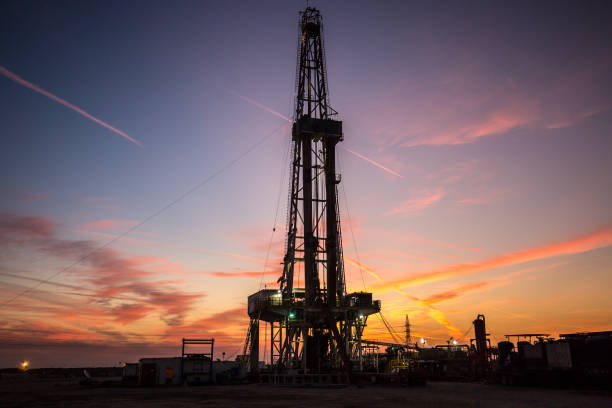istock Oil drilling platform at sunset 1196977164