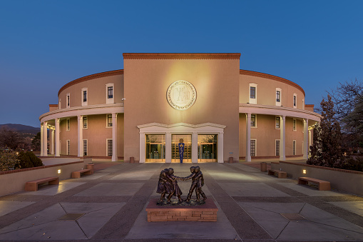 Santa Fe, New Mexico, USA - November 11, 2019: The New Mexico State Capitol at twilight on Old Santa Fe Trail in Santa Fe