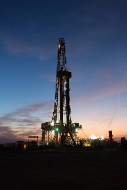 istock Oil drilling platform at sunset 1196978476
