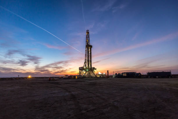 istock Oil drilling platform at sunset 1196978590