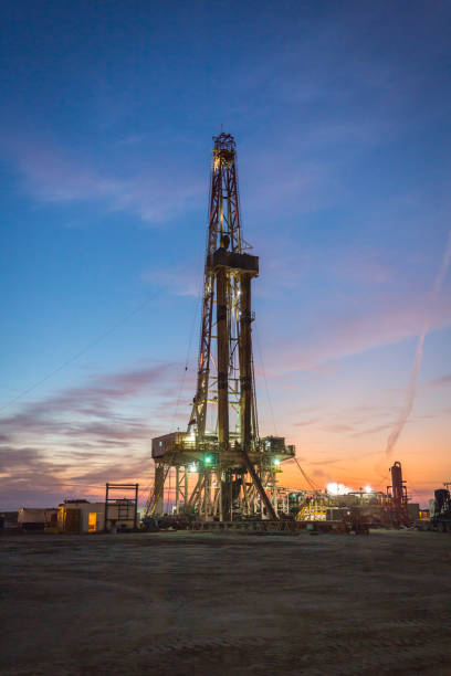 istock Oil drilling platform at sunset 1196978675