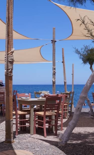 istock Cafe on the beach in Santorini 1196979336