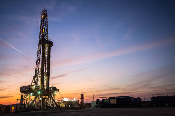 istock Oil drilling platform at sunset 1196979389