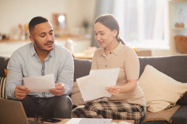 istock Modern Family Doing Taxes 1196980268