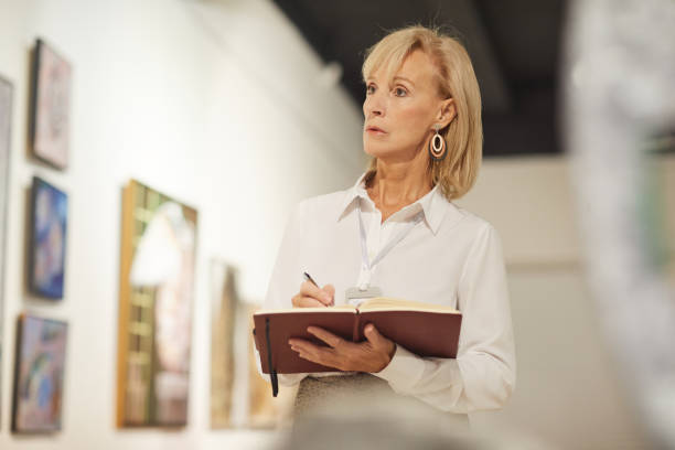 istock Woman Managing Art Gallery Exhibition 1196980511