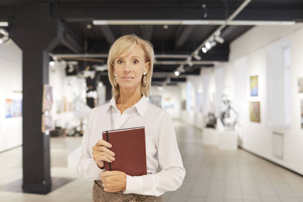 istock Elegant Art Expert Posing in Gallery 1196980531