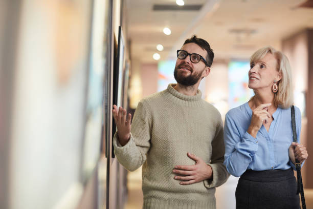 istock Mature Couple Enjoying Art Exhibition 1196980539