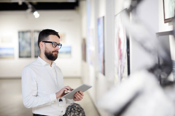 Bearded Man Managing Modern Art Gallery