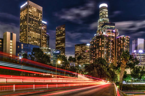 istock Los Angeles Skyline with traffic light trails 1196995056
