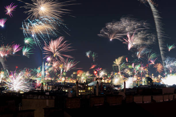 New Years Eve fireworks over Vienna, Austria with St. Stephen's Cathedral and St. Charles Church