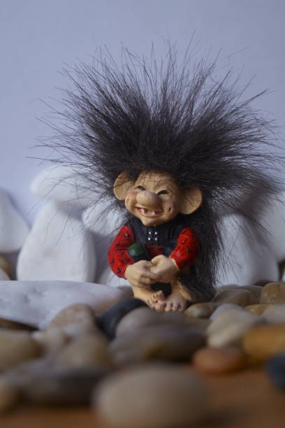 istock Background with a cute troll and stones 1196997241