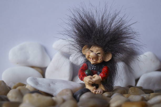 istock Background with a cute troll and stones 1196997243