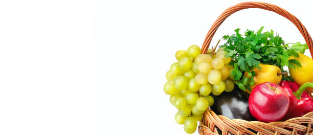 istock Vegetables and fruits in a basket isolated on white background. 1196997486