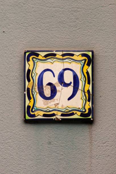 istock number 69 vintage ceramic house number on stone wall 1197000252