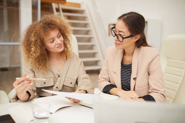 istock Two Businesswomen Sharing Ideas 1197000460