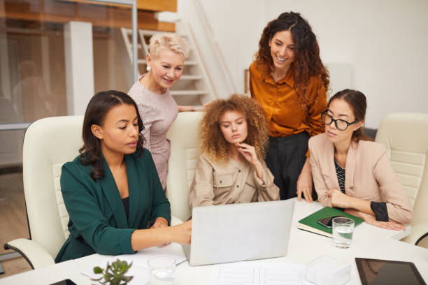 istock Five Businesswomen Coworking In Office 1197000472