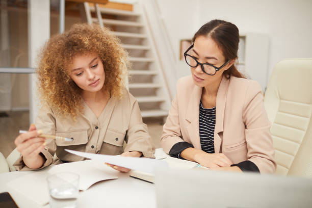 istock Two Young Women Coworking 1197000476