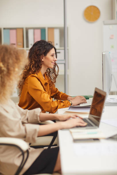 istock Two Young Businesswomen Working On Computers 1197000526