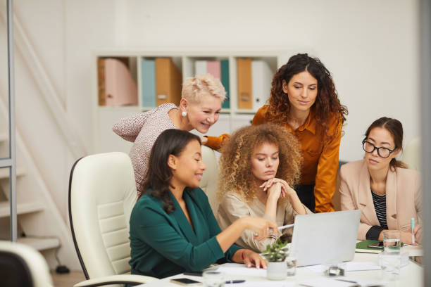 istock Stylish Women Coworking In Office 1197000528