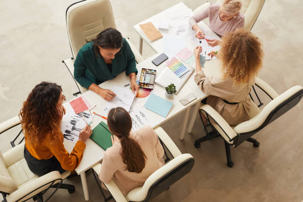 istock Five Designers Coworking Top Shot 1197000570
