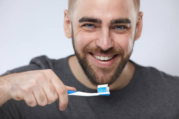 istock Man With Toothbrush Portrait 1197000738