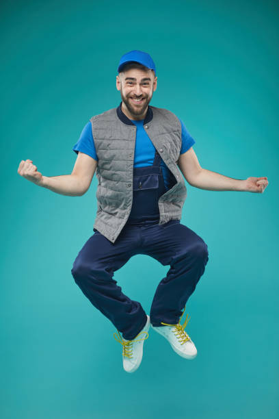 istock Happy Male Worker Jumping 1197001315
