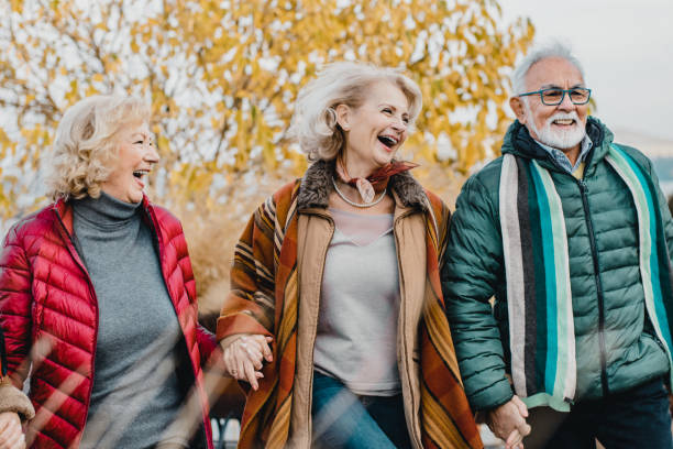 istock Three happy seniors in the park 1197011694