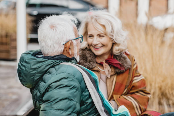 istock Happy senior couple on the bench 1197011717