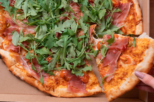 istock Pizza in a cardboard box. View from above 1197013883