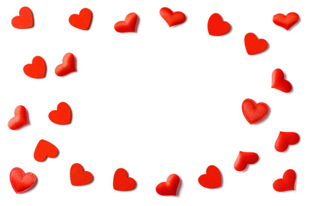 istock Festive composition from red gift box, snowflakes, hearts scattered and isolated on white background 1197014900