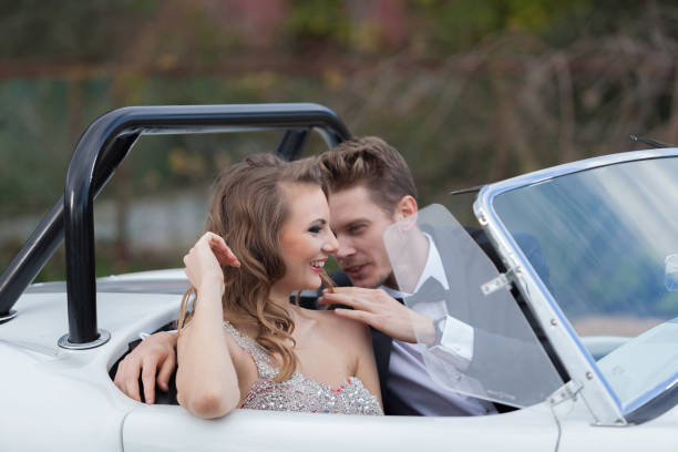 istock Young elegance couple at the white vintage car 1197015889
