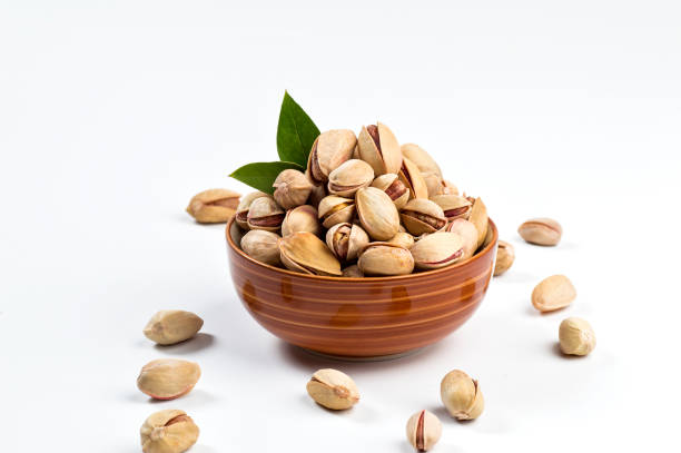 istock Pistachio in bowl on white background 1197016029
