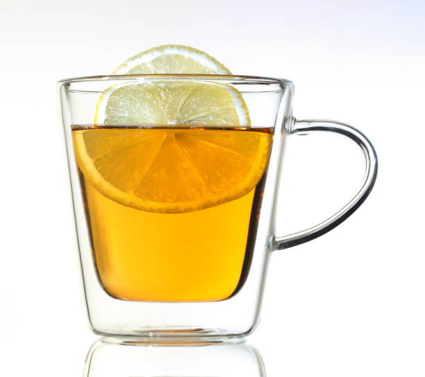 istock Tea with lemon in a glass thermo cup on a white background. 1197016087