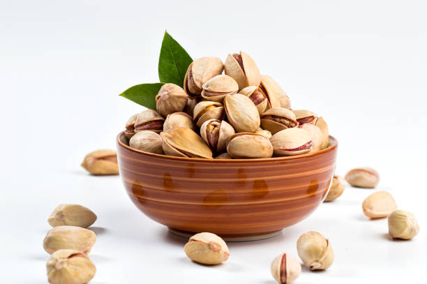 istock Pistachio in bowl on white background 1197016832