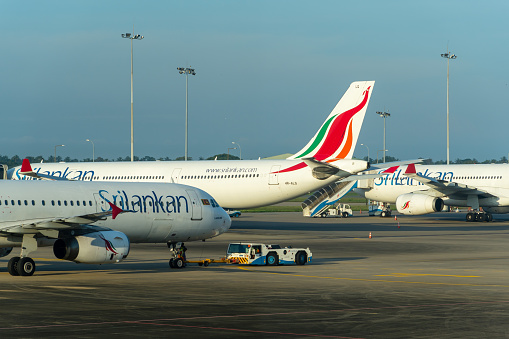 Negombo - Sri Lanka, November 17, 2019: SriLankan airlines Airbus airplanes board passengers and undergo ground handling services in the most popular Srilankan airport of Colombo