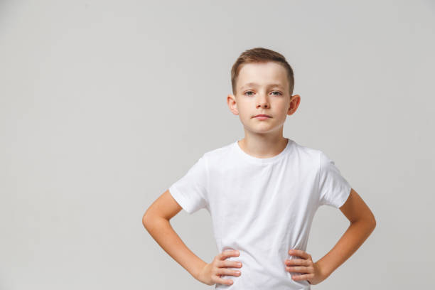 istock Boy express determination and confidence holding his hands on waist . 1197017155