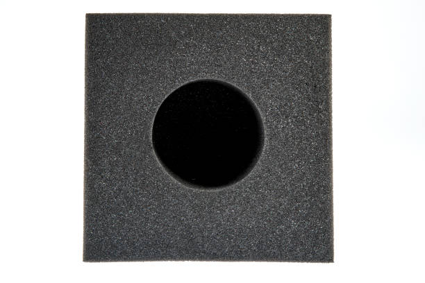istock Black sponge foam in a shape of electronic or computer part, a protective equipment on white background. 1197019905