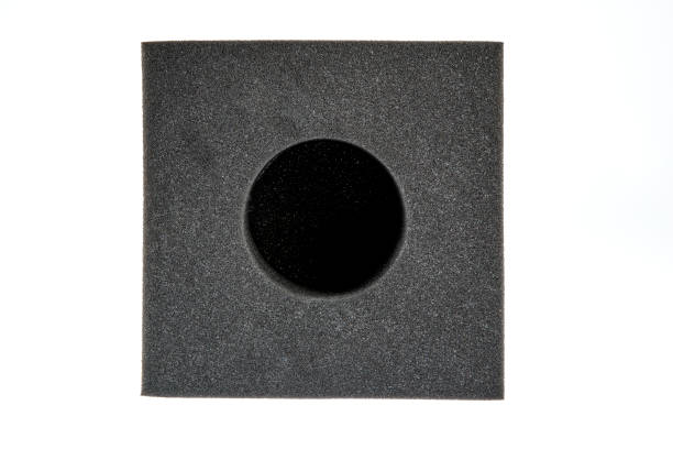 istock Black sponge foam in a shape of electronic or computer part, a protective equipment on white background. 1197019927