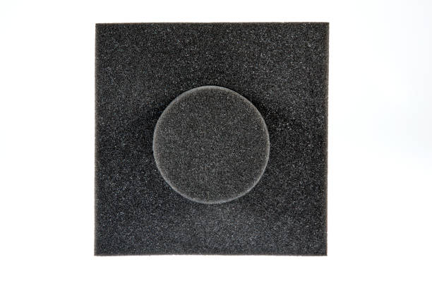 istock Black sponge foam in a shape of electronic or computer part, a protective equipment on white background. 1197020535