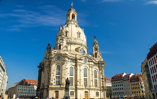 Statue of Martin Luther in front of famous lutheran church of Our Lady Frauenkirche on the central city square in Dresden, Germany