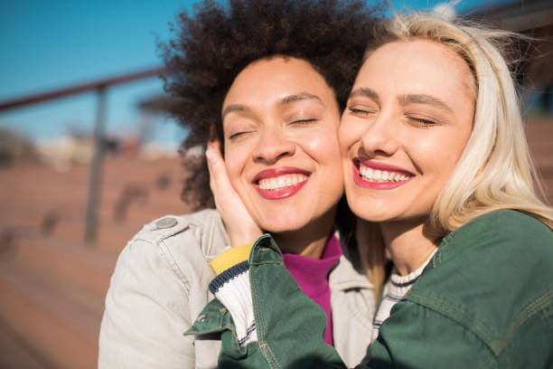 istock Two girls hugging 1197022408